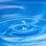 water drops on blue water