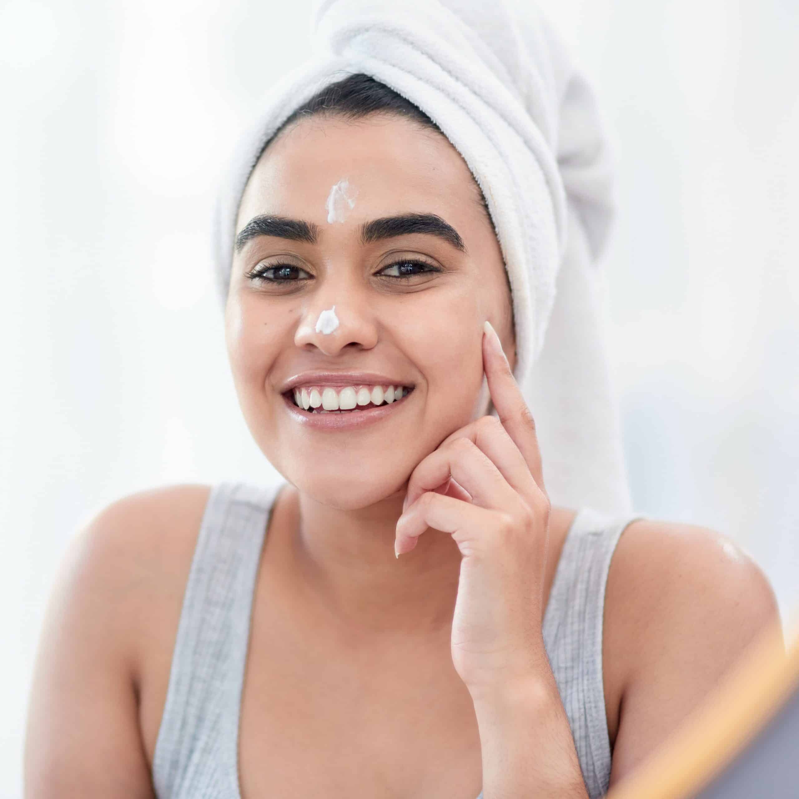 daily moisturiser sq smiling young woman