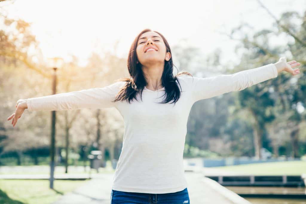 Hipster girl enjoying nature in the park