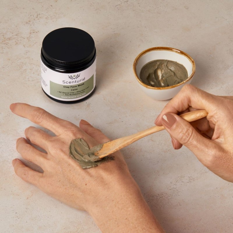 The NZ Glacial Clay Mask being mixed into a smooth paste in its handcrafted porcelain bowl with the bamboo spoon.